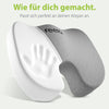 Ergonomisches Sitzkissen von feela in Dunkelgrau, das sich durch Memory-Schaum perfekt an die Körperform anpasst, mit dem Slogan 'Wie für dich gemacht.'